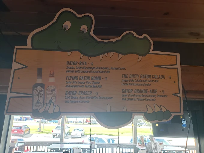 Signature Gator cocktail menu hanging from the ceiling