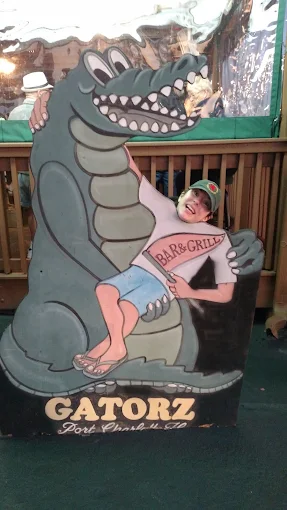 Gatorz photo-op cutout with cartoon gator and Port Charlotte branding